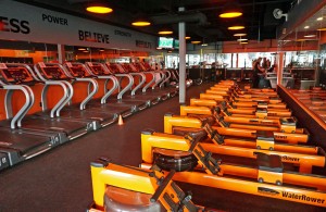 Orangetheory focuses on cardio-intensive workouts with rowing machines and treadmills. 
