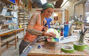 Heather Cleveland works on a board. 