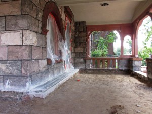 Much of the work is centered on the house's porch. 