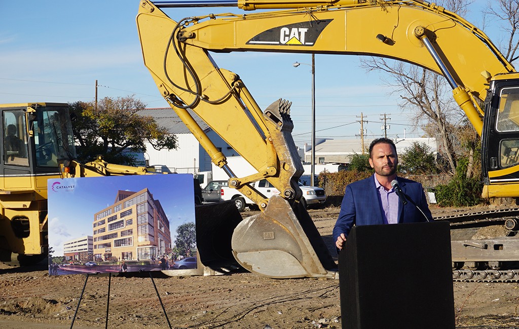 Mike Biselli speaks at the groundbreaking ceremony for the Catalyst building at the corner of 35th and Brighton. (Burl Rolett)