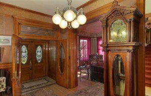 The entryway features a two-century-old mahogany grandfather clock that Adolph Zang imported from London. (Courtesy Distinctive Properties)