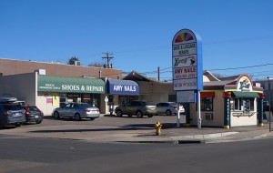 The development will replace a shopping strip that hosts a shoe shop, nail salon, dry cleaner and coffee hut. (Burl Rolett)