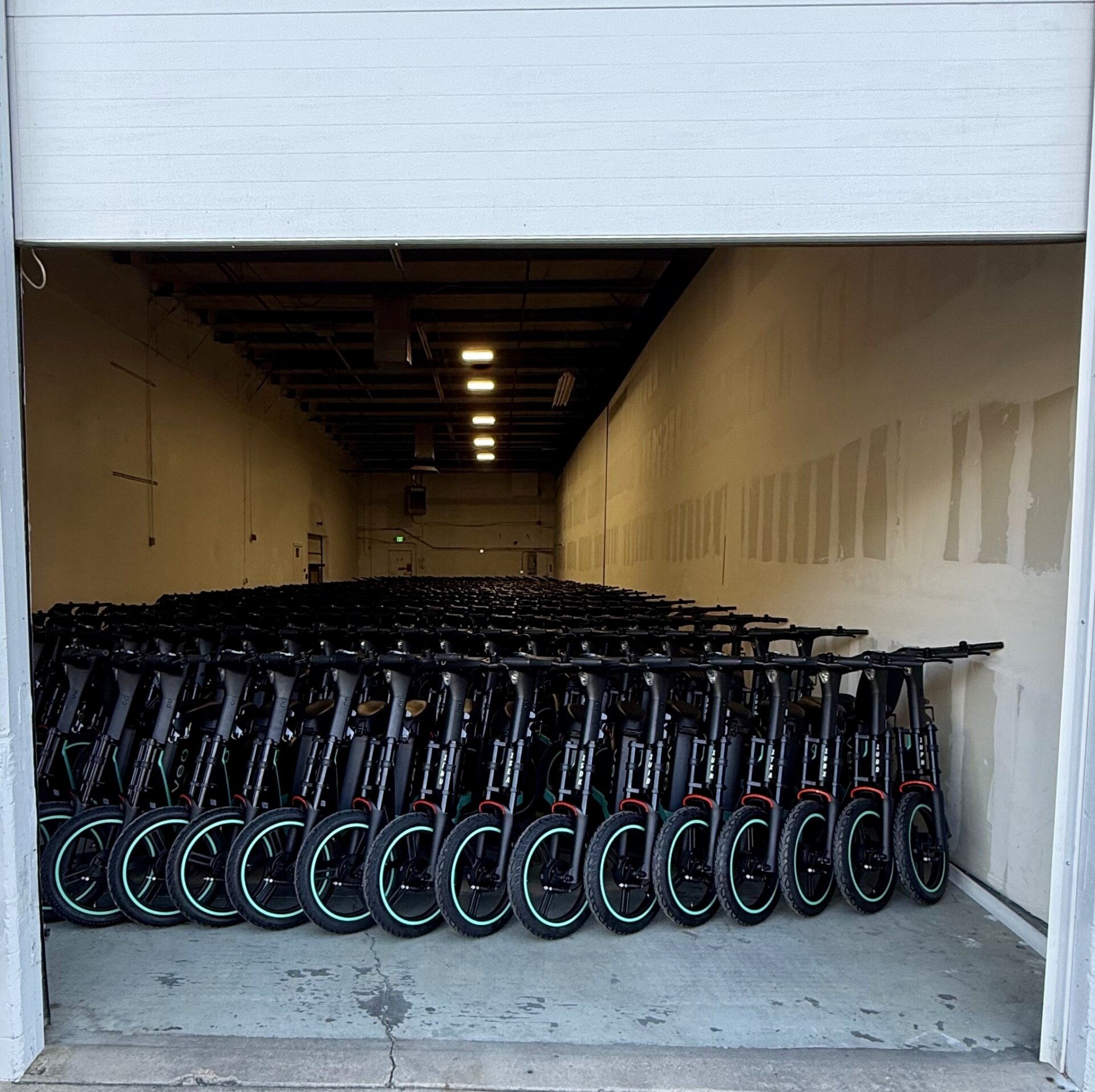 Veo scooters in a warehouse