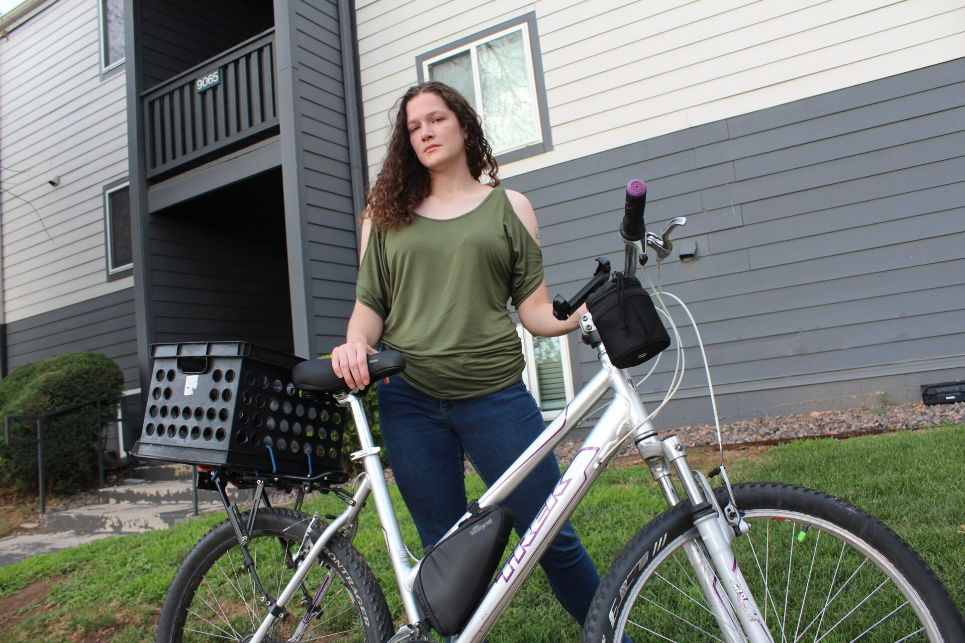 Carah Pennington with her current bike outside her home.