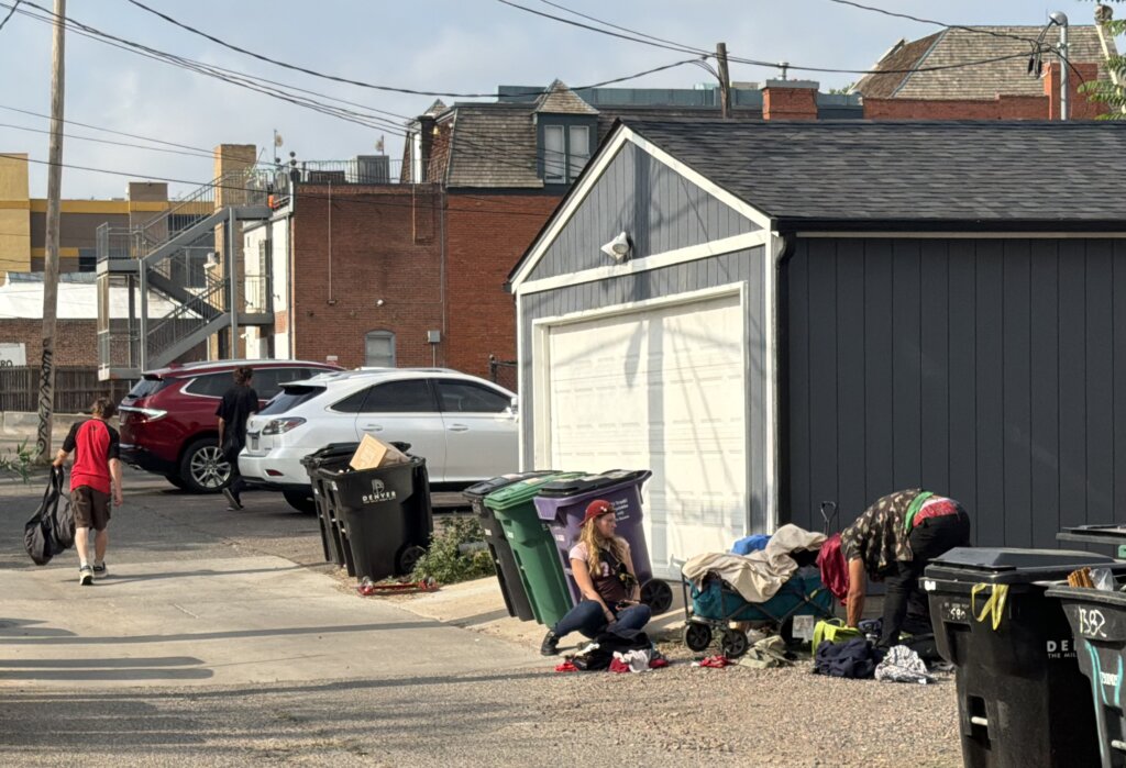Homeless people loiter outside the Jesus Discipleship Center