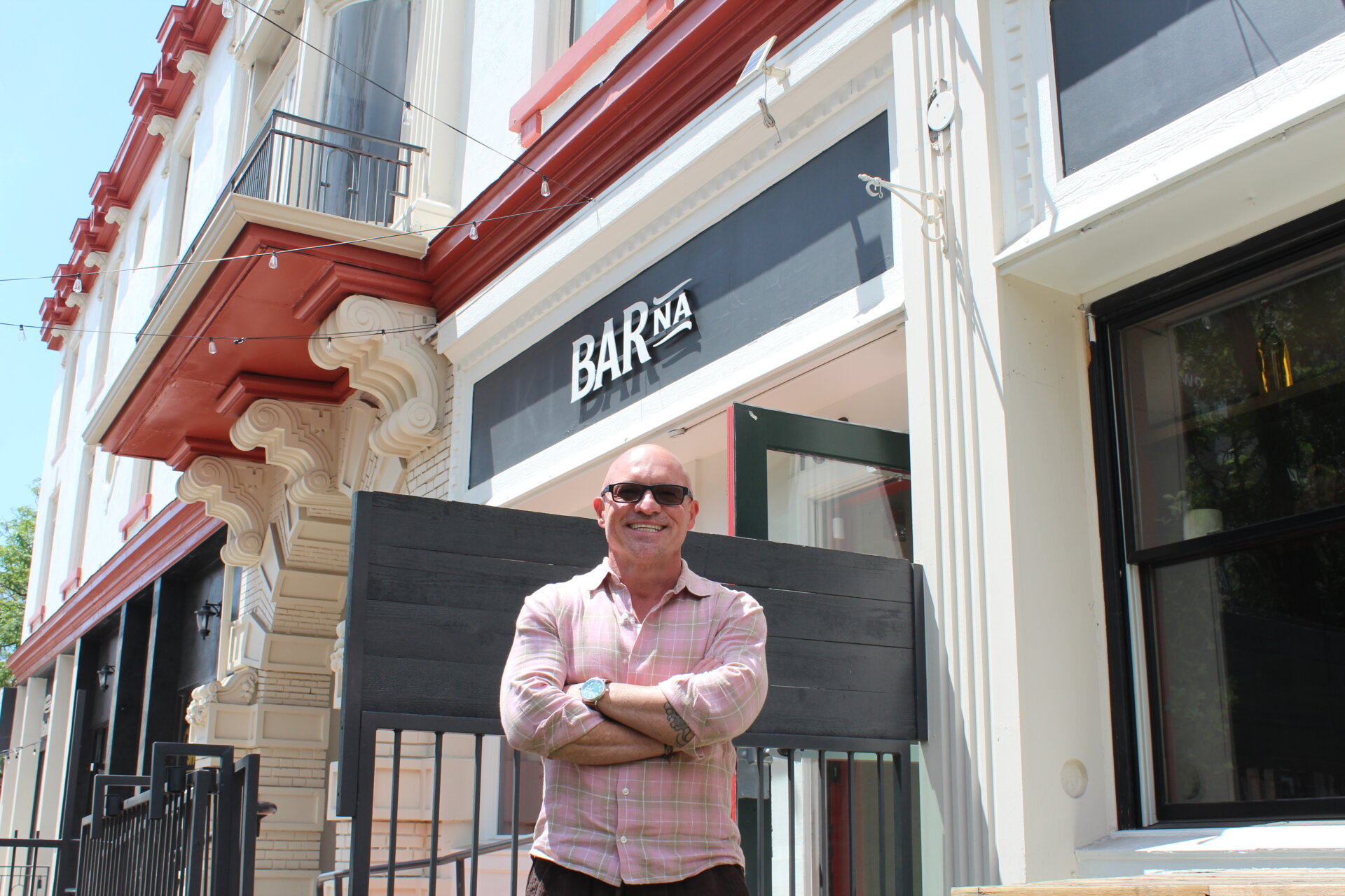 Robert Thompson standing in front of BARna on Colfax.