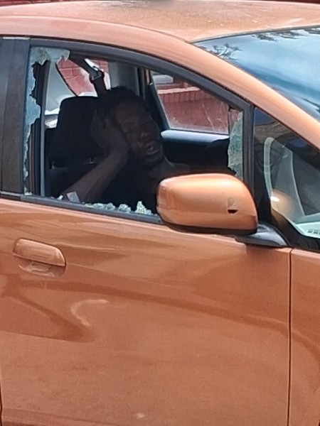 A homeless man sleeps in the car he broke into.