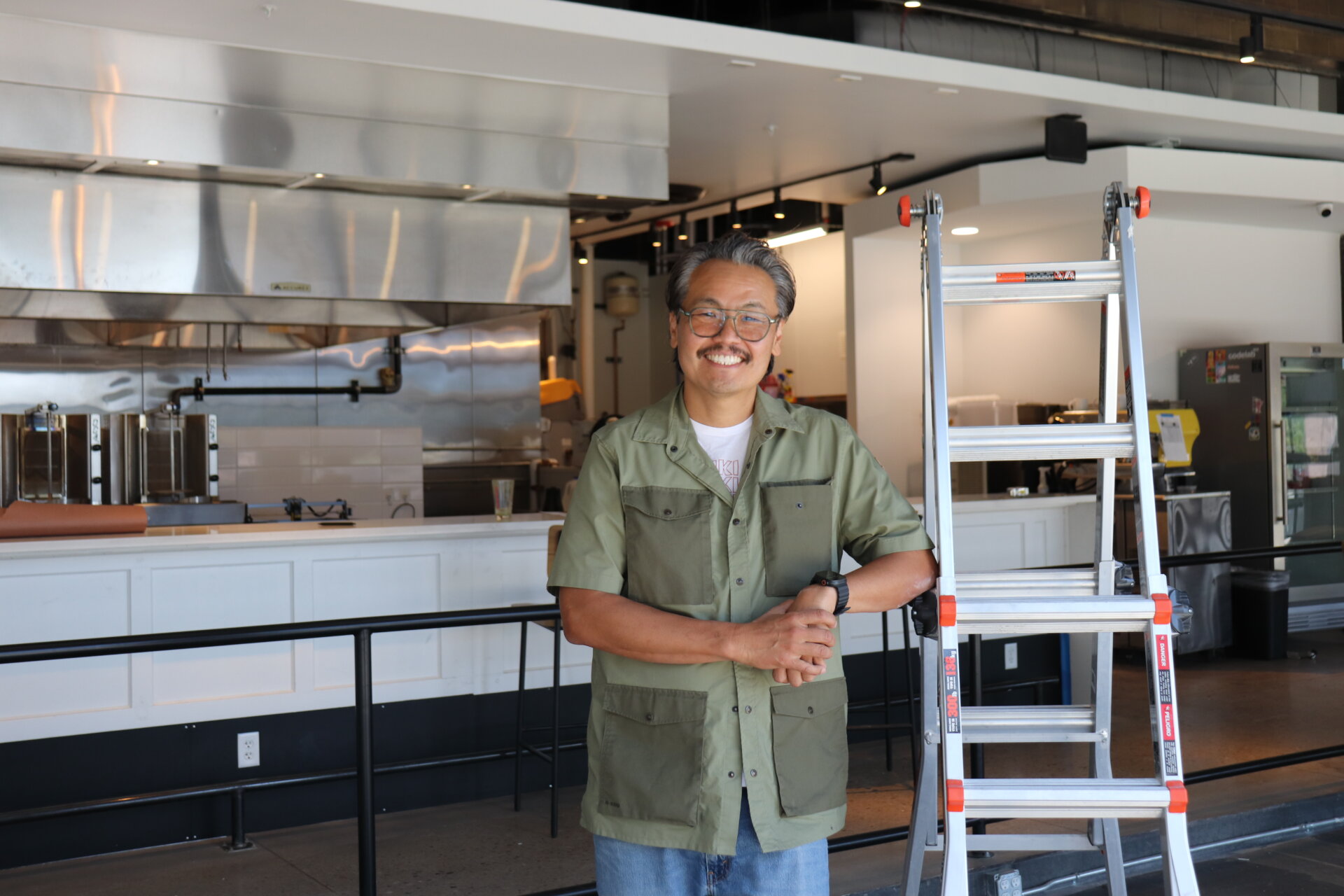 Ed Arai stands inside his restaurant that's currently under construction.
