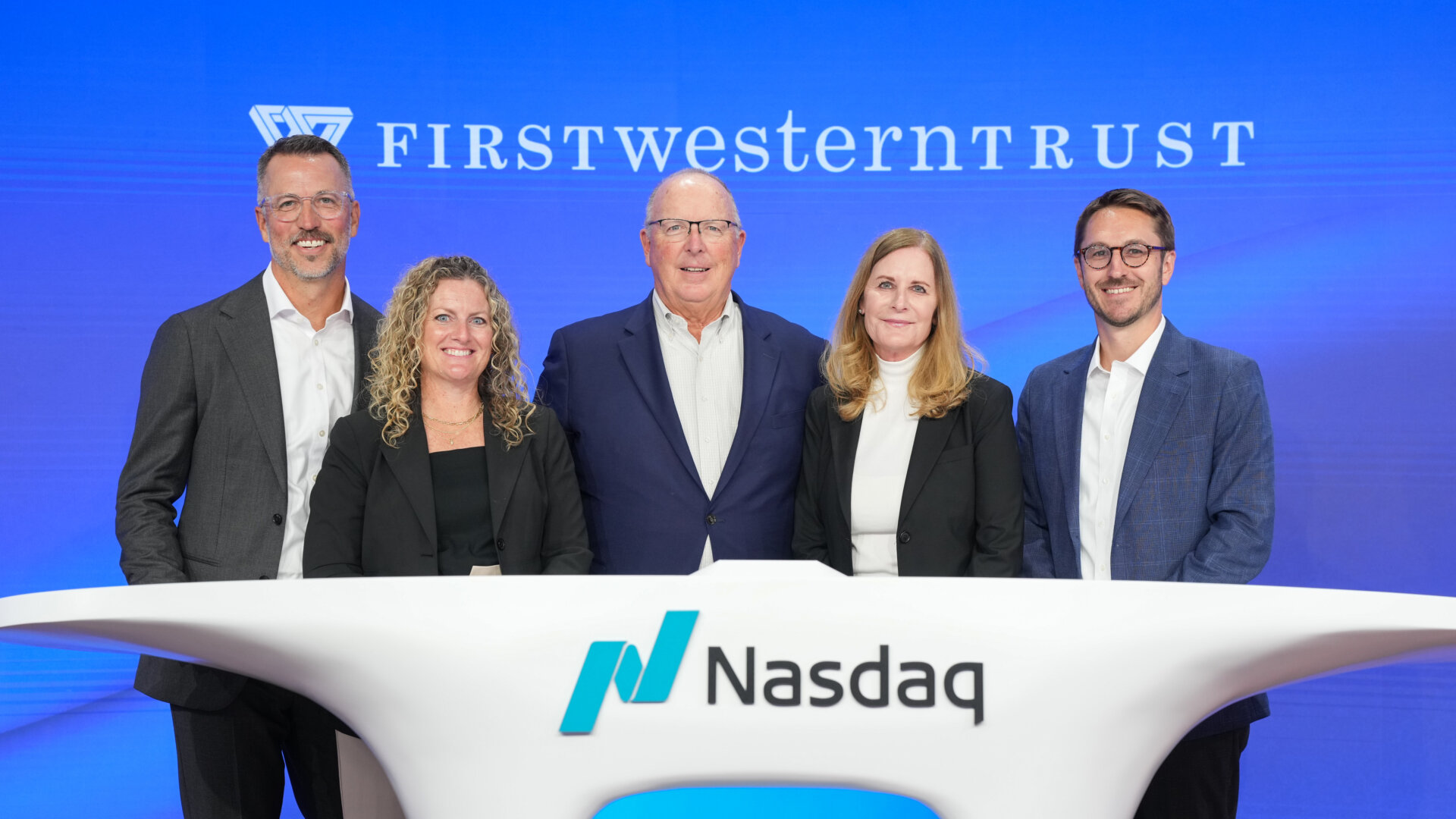 From left to right: Nathan Courkamp, Julie Courkamp, President, Scott Wylie, Founder, Chairman, and CEO of First Western Financial, Inc. and First Western Trust Bank, Joni Wylie, and David Weber, Chief Financial Officer, ring the Nasdaq Closing Bell.