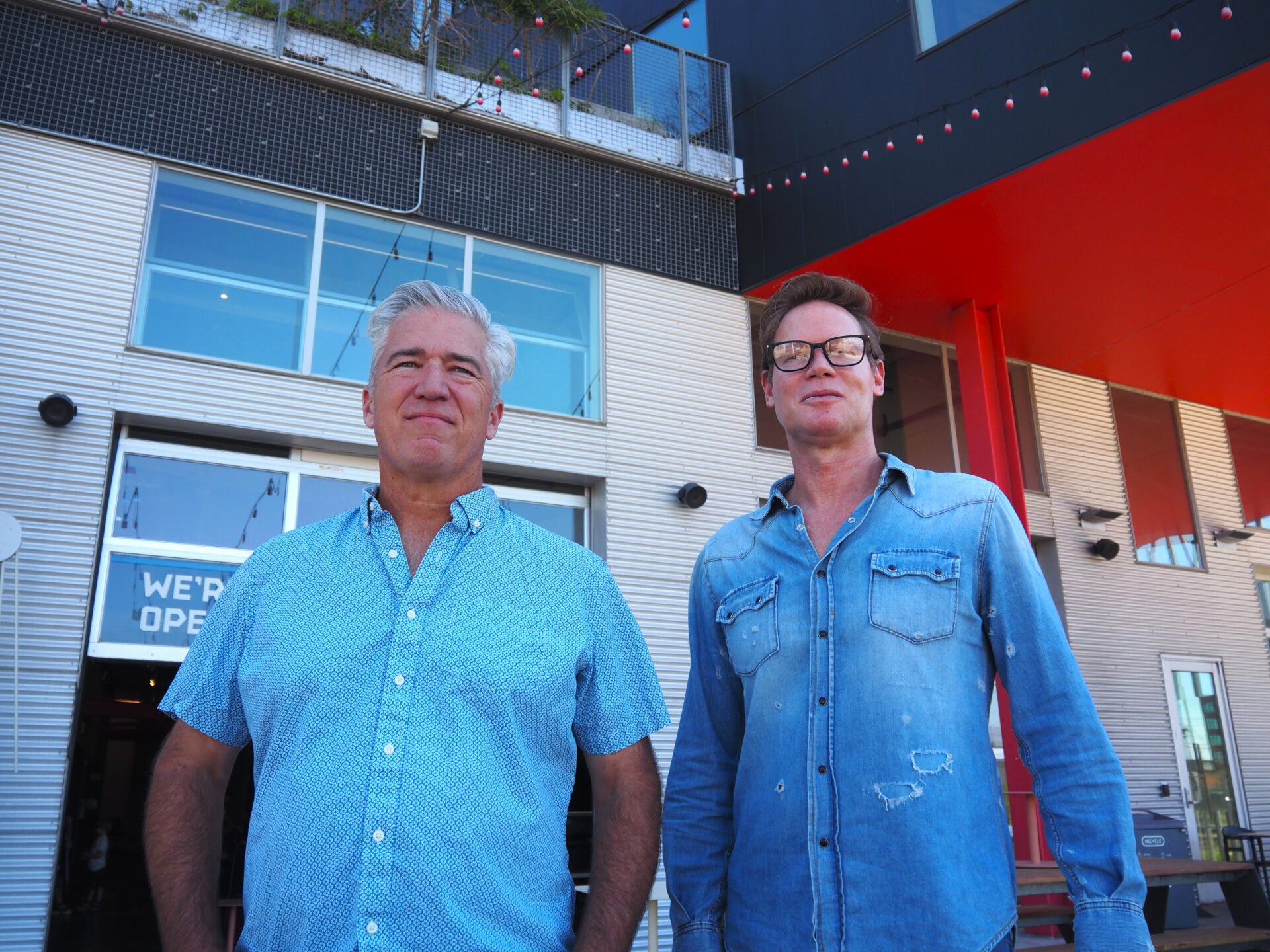 Kyle Zeppelin and Neil Adam stand outside Zeppelin Station