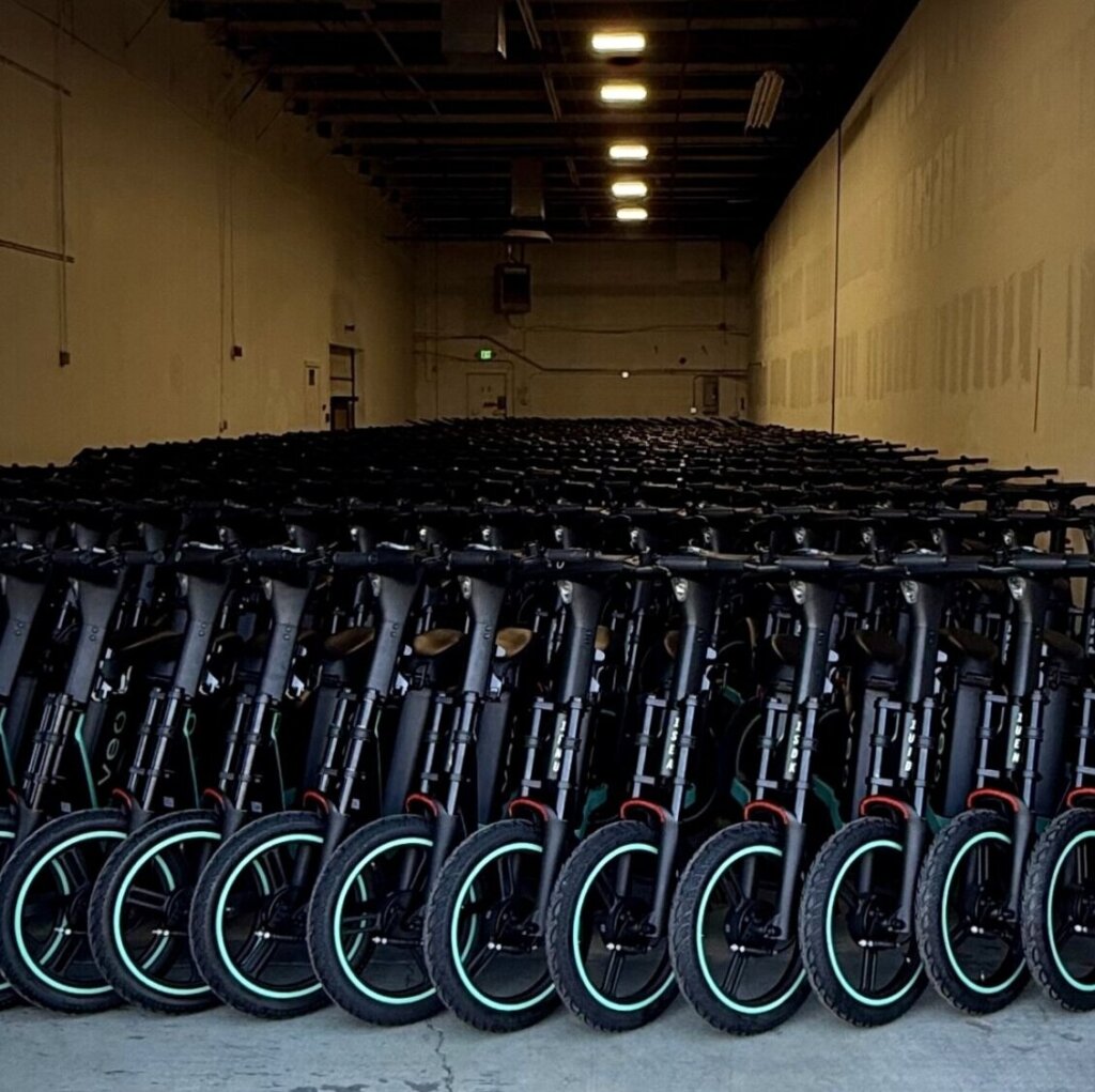 Veo scooters in a warehouse